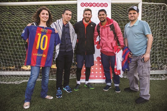 Leo Messi meeting Ooredoou2019s u2018Stand For Goodu2019 winners.