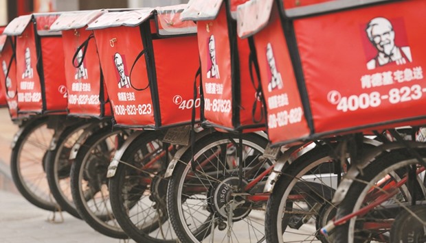 Logos of KFC, owned by Yum Brands, are seen on its delivery bicycles in front of its restaurant in Beijing. The firm has long-term ambitions to triple its outlets in China to more than 20,000, but as dining habits change in the worldu2019s fastest growing major economy, food delivery is also becoming a crucial area for restaurant operators to improve sales.