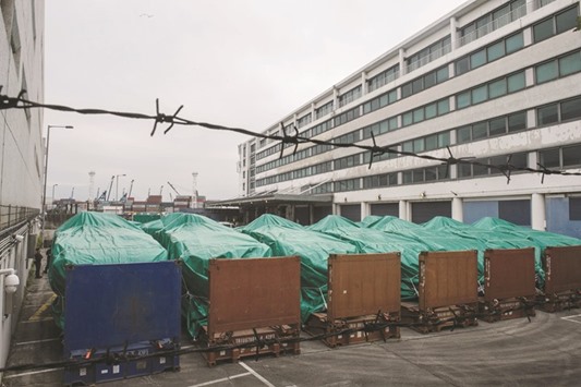 Armoured vehicles belonging to the Singapore military are seen covered with tarpaulin at a customs and excise facility in Hong Kong.