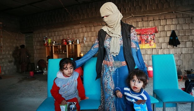 Displaced women and children from the minority Yazidi sect, who were kidnapped by Islamic State militants of Tal Afar but managed to escape, are seen at a house in Duhok province, northern Iraq.