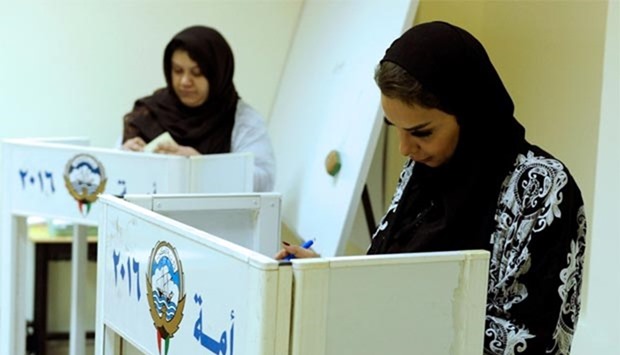 Kuwaiti women cast their votes during parliamentary election, in Kuwait City on Saturday.