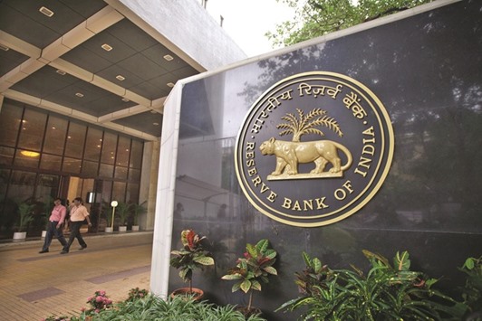 A signage of the Reserve Bank of India is displayed at the entrance to the banku2019s headquarters in Mumbai. The RBI yesterday unexpectedly ordered banks to deposit their extra cash with it, in a bid to absorb excess liquidity generated by a government ban on larger banknotes.