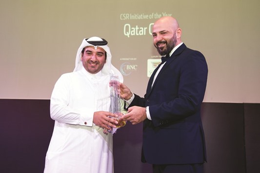Al-Malki receives the award on behalf of Qatar Cool.