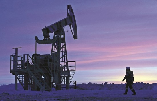 A worker at an oil field owned by Bashneft, Bashkortostan, Russia in this January 28, 2015 file photo. Opec officials were scheduled to meet with non-members  including Russia tomorrow before a ministerial meeting in Vienna two days later. The meeting was later cancelled entirely after the Saudis decided not to take part.