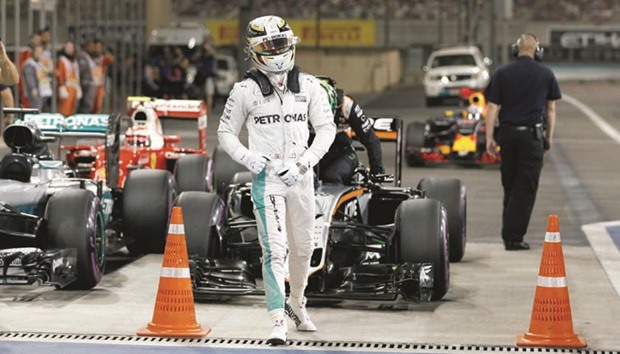 Mercedesu2019 Formula One driver Lewis Hamilton of Britain gets out of his car after taking pole position in qualifying session yesterday at the Yas Marina Circuit.