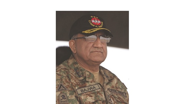 In this photograph taken on November 16, 2016, Pakistani Army General Qamar Javed  Bajwa watches a military exercise on the Indian border in Khairpure Tamay Wali in Bahawalpur district.