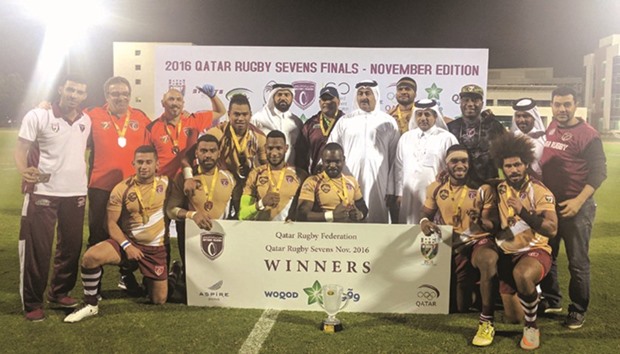 Camels pose with the winnersu2019 trophy and officials after winning the Qatar Rugby 7s tournament at the Aspire Warm-up Track on Friday.