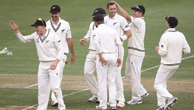 New Zealandu2019s Tim Southee (centre) celebrates the wicket of Pakistanu2019s Younis Khan with teammates in Hamilton yesterday. (AFP)