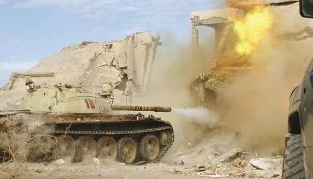 A military vehicle fires as fighters of Libyan forces allied with the UN-backed government push into the last area held by Islamic State militants in Ghiza Bahriya district in Sirte yesterday.