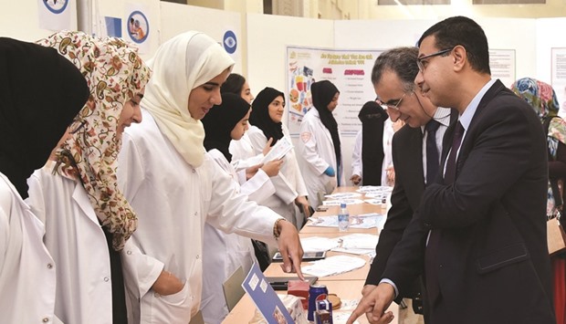 Students and visitors at a booth at the u2018Eyes on Diabetesu2019 event.