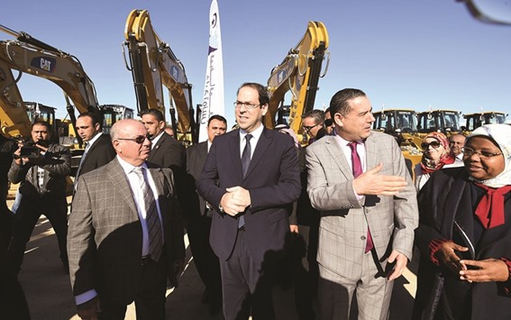 Tunisian Prime Minister Youssef Chahed (centre) attends an event to kick off an investment project ahead of the international conference on investment, Tunis 2020, in Raoued in the district of Ariana yesterday. Tunisia will host 2,000 business and finance executives from 40 countries this week in hopes of drumming up investment to boost its struggling economy.