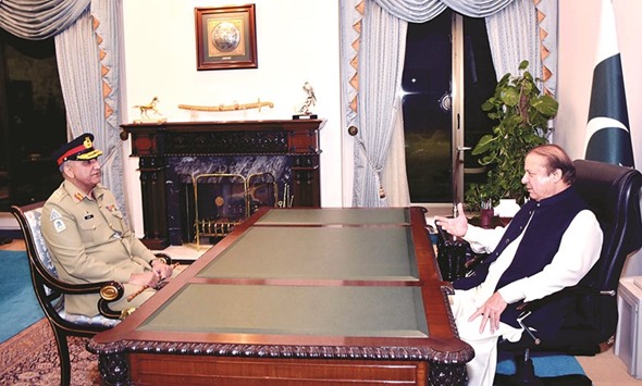 Pakistanu2019s Prime Minister Nawaz Sharif talks with Qamar Javed Bajwa, Pakistanu2019s newly designated Army Chief, at the Prime Ministeru2019s House in Islamabad, on Saturday.