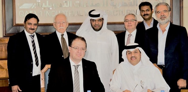Al-Ansari and El Bacha with other executives at the signing ceremony to establish a calcium chloride plant at the Mesaieed Industrial City. The 60,000 tpy plant is being set up by KLJ Organic Qatar and Gulf Chlorine.