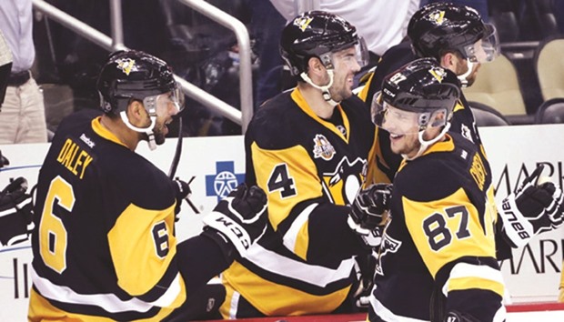 Pittsburgh Penguins centre Sidney Crosby (No 87) celebrates with teammates scoring a goal to tie the game against the New Jersey Devils. PICTURE: USA TODAY Sports