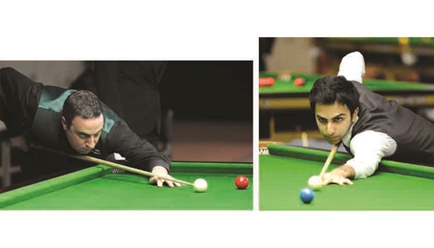 Irelandu2019s Michael Judge in action at the IBSF World Snooker Championship yesterday.  Right photo: Indiau2019s Pankaj Advani in action during his pre-quarter-final against Malaysiau2019s Keen Hoo Moh.