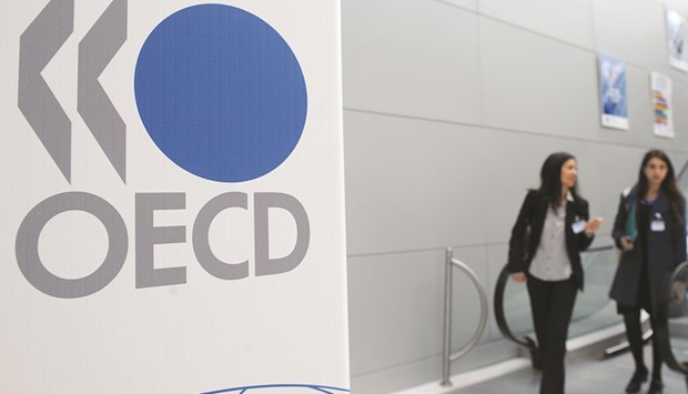 The OECD logo is seen at the companyu2019s headquarters in Paris. In its twice-yearly Economic Outlook, the OECD has estimated global growth would accelerate from 2.9% this year to 3.3% in 2017 and reach 3.6% in 2018.