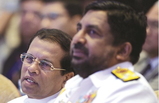 Sri Lanka President Maithripala Sirisena, left, and navy chief Vice Admiral Ravindra Wijegunaratne attend the international maritime conference, Galle Dialogue 2016 in Colombo yesterday.