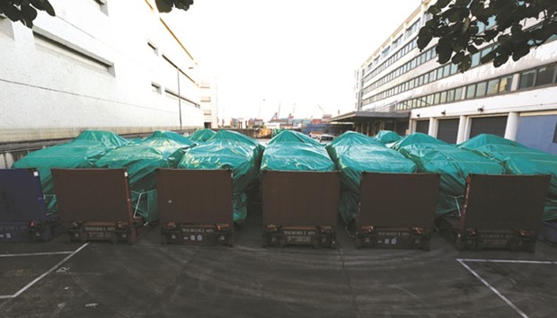 Armoured troop carriers, belonging to Singapore, are detained at a cargo terminal in Hong Kong yesterday.