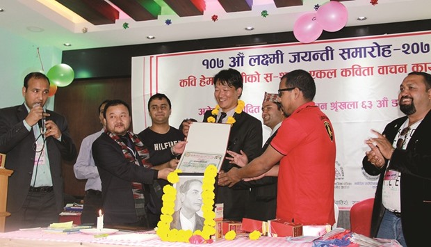 Heman Yatri being presented a memento at the event.