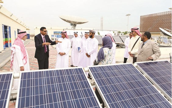 Participants of  the GSO Technical Committee for Renewable Energy and Power Storage Technologies (GSO-TC13) inspecting a solar panel facility in Doha during their field trip.
