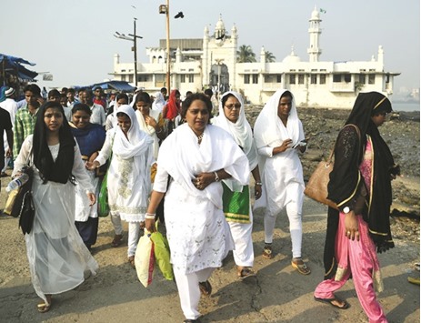 Women leave after visiting the inner sanctum of the Haji Ali Dargah in Mumbai yesterday.