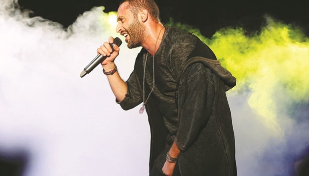 Arab-Israeli rapper Tamer Nafar performs on-stage during a festival in the northern Arab-Israeli town of Sakhnin last month.