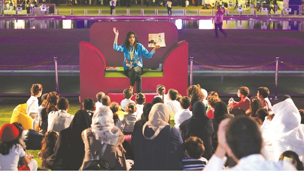 Visitors listen to a storyteller at the u2018Charactersu2019 Villageu2019 as part of Qatar Foundationu2019s National Reading Campaign held recently at Education City.