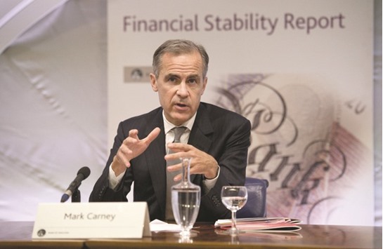 BoE governor Mark Carney hosts a Financial Stability Report press conference in London yesterday. Carney said any new protectionist US trade policies could throw u201csand in the gearsu201d of the global economy, with knock-on effects for Britain.
