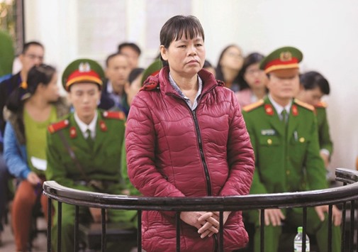 Can Thi Theu, a farmer and land protection activist, stands in the dock during her appeal trial at a court in Hanoi, Vietnam yesterday.