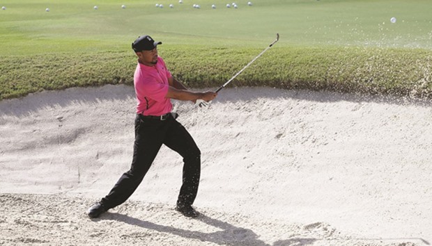 Tiger Woods practices chipping from a bunker ahead of the Hero World Challenge at Albany in Nassau, Bahamas. (Getty Images/AFP)