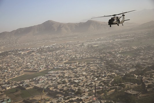 A Black Hawk helicopter flies over Kabul October 3, 2014.