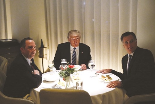 Donald Trump with Mitt Romney and his choice for White House chief of staff Reince Priebus at Jean-Georges at the  Trump International Hotel & Tower in New York.