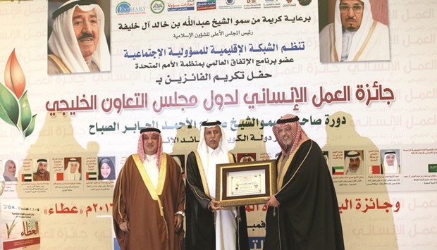 HE the Deputy Prime Minister and Minister of State for Cabinet Affairs Ahmed bin Abdullah bin Zaid al-Mahmoud receiving the award in Manama yesterday.