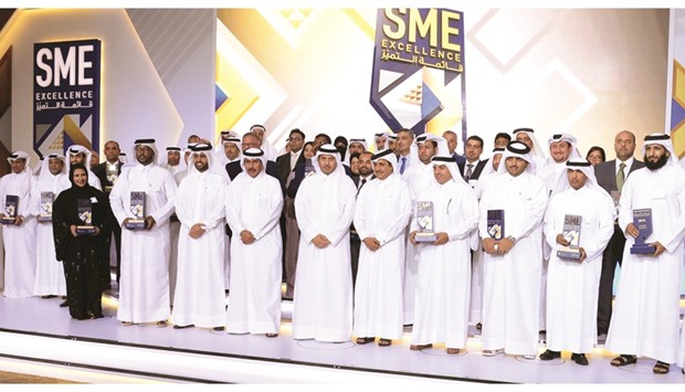 HE the Prime Minister and Minister of the Interior Sheikh Abdullah bin Nasser bin Khalifa al-Thani joins HE the Governor of Qatar Central Bank Sheikh Abdullah bin Saud al-Thani, Qatar Chamber chairman Sheikh Khalifa bin Jassim al-Thani, QDB CEO Abdulaziz bin Nasser al-Khalifa, and the recipients of the u2018SME Excellence List 2016u2019 awards. PICTURE: Thajudheen.