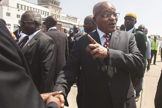 Zuma is greeted upon his arrival yesterday for an official state visit at the Harare International Airport.