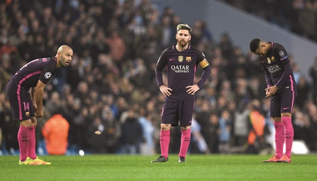 Barcelonau2019s defender Javier Mascherano, strikers Lionel Messi (C) and Neymar (R) react following the UEFA Champions League group C match against Manchester City at the Etihad Stadium in Manchester on Tuesday. (AFP)