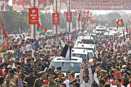 Uttar Pradesh Chief Minister Akhilesh Yadav waves at his supporters during the Rath Yatra as part of an election campaign, in Lucknow yesterday.
