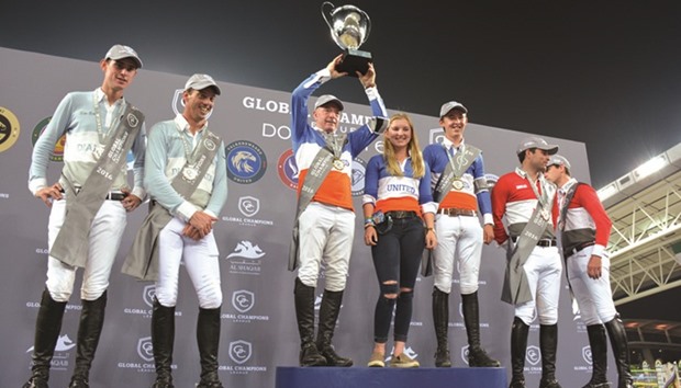 Valkenswaard United rider John Whitaker (third from left) lifts the winnersu2019 trophy after, along with teammate Bertram Allen (third from right), they won the Global Champions League at Al Shaqab Arena yesterday. PICTURES: Garsi Lotfi