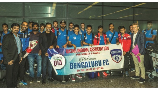 The Bengaluru team pose at the Hamad International Airport yesterday.