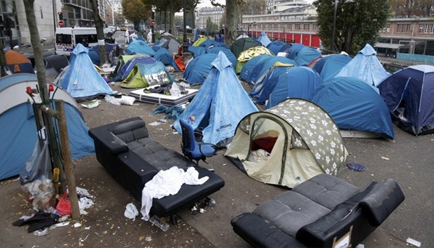 the tents of dismantled makeshift camp in a street near Stalingrad metro station in Paris