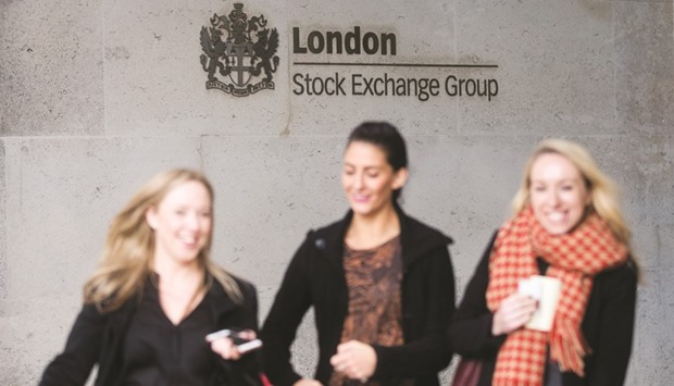 Visitors walk past a London Stock Exchange Group sign as they leave their offices in London. Londonu2019s FTSE 100 closed 1.4% down at 6,693.26 points yesterday.