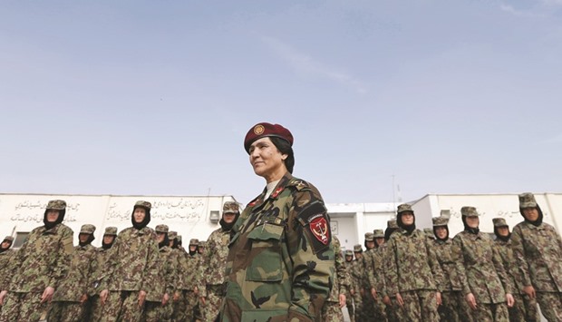 Lieutenant Colonel Cobra Tanha, 45, stands in front of her soldiers at the Kabul Military Training Centre (KMTC) in Kabul.