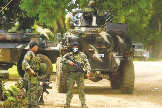 A recent photo shows Philippine soldiers standing guard next to an Armoured Personnel Carrier (APC) inside a military camp in Jolo, Sulu province on the southern island of Mindanao.