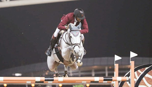 Qataru2019s Bassem Hassan Mohamed in action on Argelith Squid in the CSI5* 1.45m Speed Class at the Al Shaqab Arena yesterday. PICTURES: Garsi Lotfi