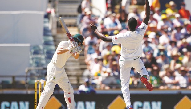 South Africau2019s Kagiso Rabada celebrates after taking a catch to dismiss Australiau2019s Adam Voges at the WACA Ground in Perth yesterday.