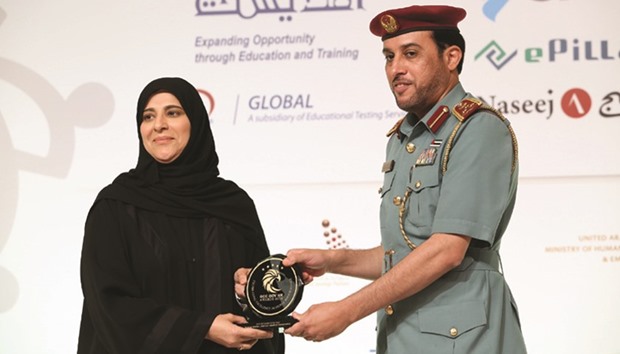 Fatima Haidar, chief human resources officer at HMC, receiving the award.