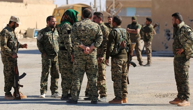 Syrian Democratic Forces (SDF) gather in the town of Ain Issa