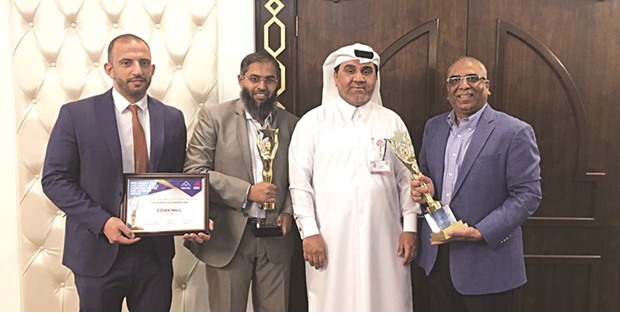 Al-Obaidli (third right) with senior Ezdan Mall officials who won the awards at the recently concluded u20182016 ICSC Middle East and North Africa Shopping Centre and Retailer Awardsu2019 held during u2018RECon 2016u2019 in Dubai.