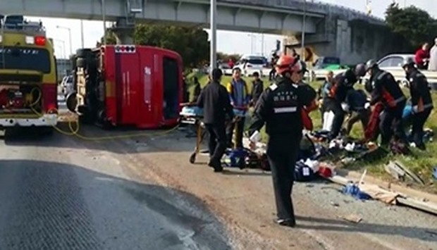 The bus suddenly swerved and flipped to its side. Picture courtesy: Yonhap news agency