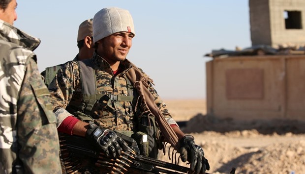 Members of US-backed Kurdish-Arab forces deploy on the frontline, one kilometre from the Syrian town of Ain Issa, some 50 kilometres north of Raqa as they launched an offensive on the Islamic State group's de facto Syrian capital.